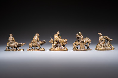 Five Chinese bronze 'Immortal' groups and a carved soapstone 'Monkeys' sculpture, 20th C.