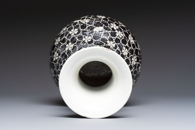 A rare Chinese famille noire 'Prunus on Cracked Ice' vase with 'Chilong' handles, 19th C.