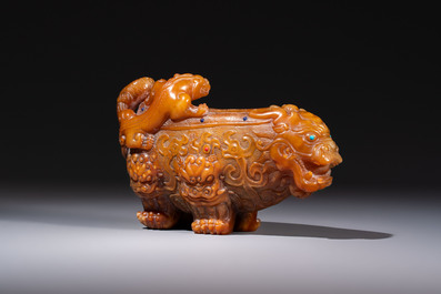 A Chinese precious-stone-inlaid carved soapstone wine vessel on stand, Gong 觥, Republic