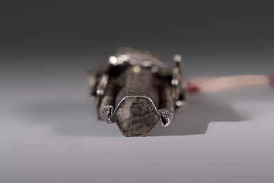 A fine Chinese silver pendant with inscriptions on a plexiglas stand, 19th C.