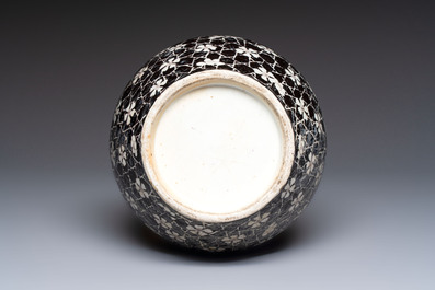 A rare Chinese famille noire 'Prunus on Cracked Ice' vase with 'Chilong' handles, 19th C.
