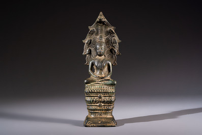 A Cambodian bronze Buddha and a Thai Buddha head, 19th C.