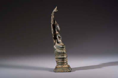 A Cambodian bronze Buddha and a Thai Buddha head, 19th C.