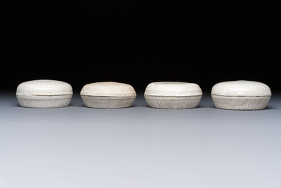 Four Chinese white-glazed boxes and covers with incised floral design from the Jepara shipwreck, Dehua or Anxi kiln, Song