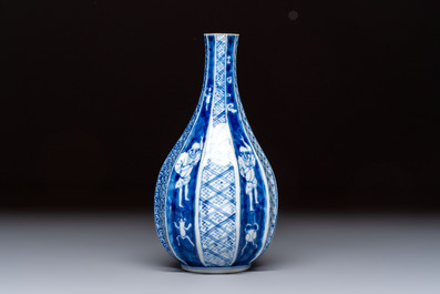 A Japanese blue and white sake bottle with figural design, Meiji, 19th C.