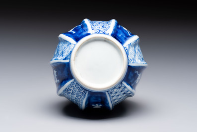 A Japanese blue and white sake bottle with figural design, Meiji, 19th C.