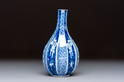 A Japanese blue and white sake bottle with figural design, Meiji, 19th C.