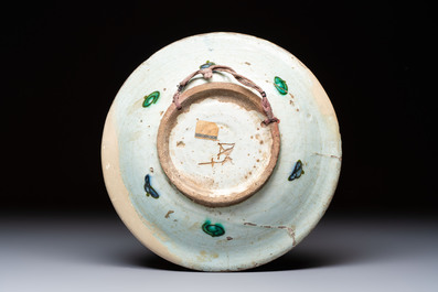 A polychrome Iznik pottery plate and two Kutahya plates, Turkey, 16/19th C.