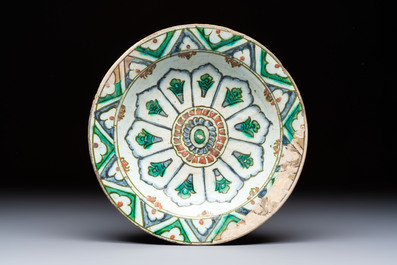 A polychrome Iznik pottery plate and two Kutahya plates, Turkey, 16/19th C.