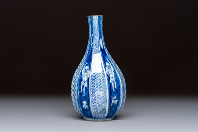 A Japanese blue and white sake bottle with figural design, Meiji, 19th C.