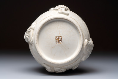 A Chinese Nanking white-glazed 'hu' vase with figural relief design, 19th C.