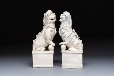 A pair of large Chinese Dehua blanc de Chine buddhist lion joss stick holders, 19th C.