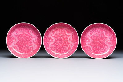Four Chinese sgraffito ruby-ground 'Dragon' cups and three plates, Qianlong mark, Republic