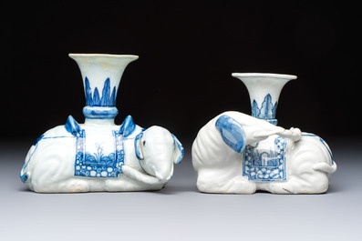 Two Chinese blue and white recumbent elephant-form candlesticks, Jiaqing