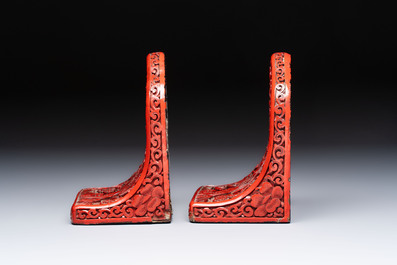 A pair of Chinese cinnabar lacquer bookends, a covered box and a brush washer, 19/20th C.