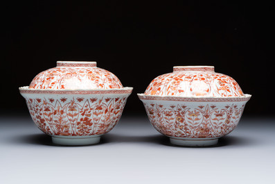 A pair of Chinese  iron-red and gilt-decorated 'Elegant Ladies and Tulips' bowls and covers, Kangxi