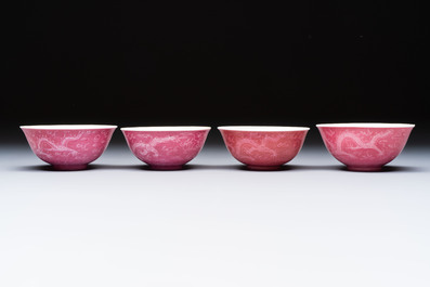 Four Chinese sgraffito ruby-ground 'Dragon' cups and three plates, Qianlong mark, Republic