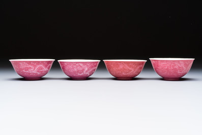 Four Chinese sgraffito ruby-ground 'Dragon' cups and three plates, Qianlong mark, Republic