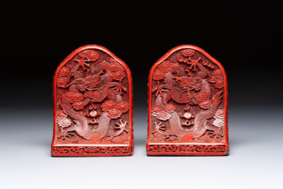 A pair of Chinese cinnabar lacquer bookends, a covered box and a brush washer, 19/20th C.