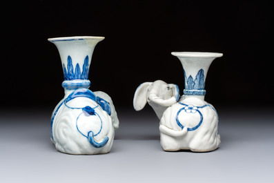 Two Chinese blue and white recumbent elephant-form candlesticks, Jiaqing