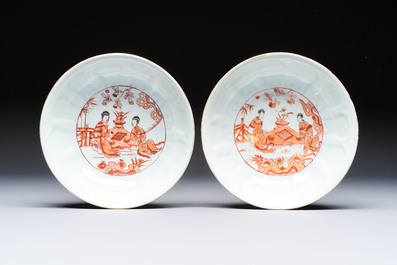 A pair of Chinese  iron-red and gilt-decorated 'Elegant Ladies and Tulips' bowls and covers, Kangxi