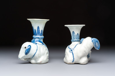 Two Chinese blue and white recumbent elephant-form candlesticks, Jiaqing