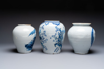 A blue and white Dutch Delft tobacco jar and two French tobacco jars with brass lids, 18/19th C.