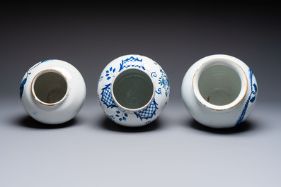 A blue and white Dutch Delft tobacco jar and two French tobacco jars with brass lids, 18/19th C.