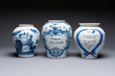 A blue and white Dutch Delft tobacco jar and two French tobacco jars with brass lids, 18/19th C.