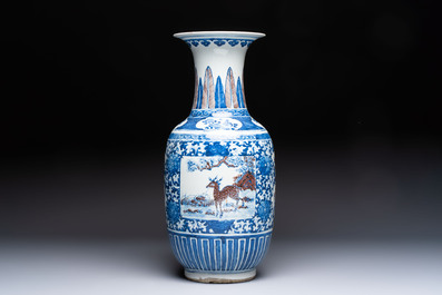 A Chinese blue, white and copper-red 'Deer' vase, 19th C.