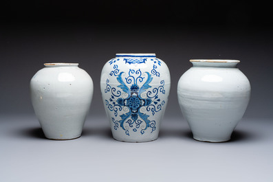 A blue and white Dutch Delft tobacco jar and two French tobacco jars with brass lids, 18/19th C.