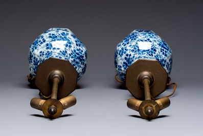 A pair of blue and white Dutch Delft garlic-head vases mounted as lamps, 18th C.