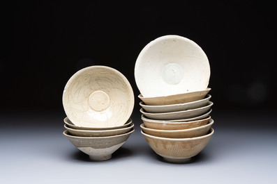 A group of 12 Chinese celadon-glazed bowls with incised floral design from the Jepara shipwreck, Fujian kilns, Song