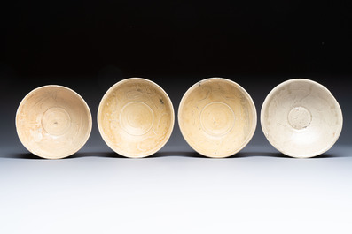 A group of 12 Chinese celadon-glazed bowls with incised floral design from the Jepara shipwreck, Fujian kilns, Song