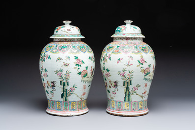 A pair of Chinese famille rose 'Roosters' vases and covers, 19th C.