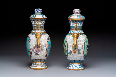 Two Chinese cloisonn&eacute; vases on wooden stands, 20th C.