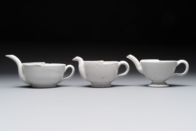 Seven white-glazed Delft or French faience feeding cups or 'Canards de Malade', 19th C.