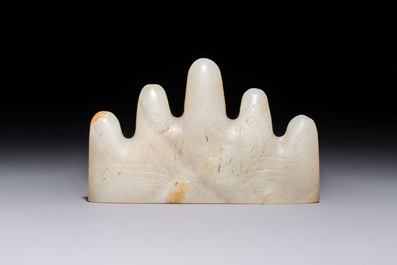 A Chinese white jade mountain-shaped brush rest with narcissus design, Dajie 大玠 mark, dated 1879