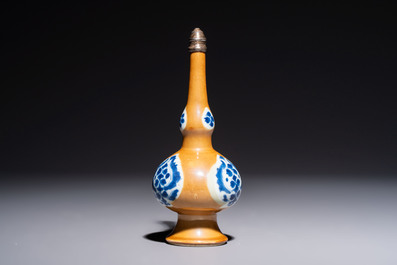 A Chinese blue and white capucine-ground rosewater sprinkler with silver mount, Kangxi