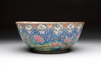 A Chinese Canton famille rose 'peacock' punch bowl, 19th C.