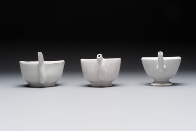Seven white-glazed Delft or French faience feeding cups or 'Canards de Malade', 19th C.