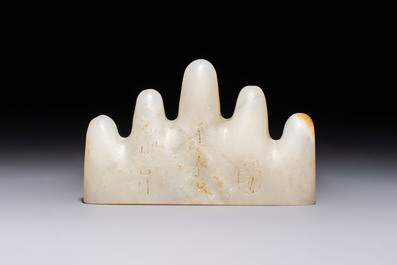 A Chinese white jade mountain-shaped brush rest with narcissus design, Dajie 大玠 mark, dated 1879