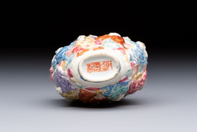 A Chinese famille rose moulded '18 Luohan' snuff bottle, Qianlong mark, 19th C.