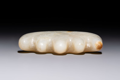 A Chinese white jade mountain-shaped brush rest with narcissus design, Dajie 大玠 mark, dated 1879