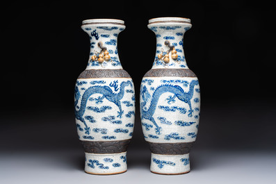 A pair of Chinese blue and white Nanking crackle-glazed 'Dragons' vases, 19th C.