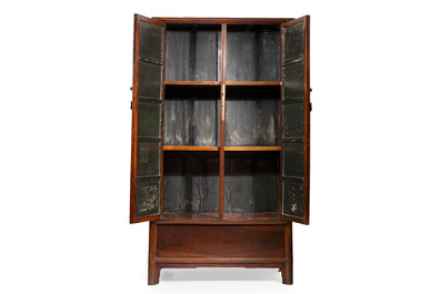 A large Chinese elmwood tapered round-corner cabinet, 'Yuanjiaogui', early Qing, 17/18th C.