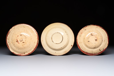 Three Hispano-Moresque lustre-ware plates on later metal stands, Spain, 17/18th C.