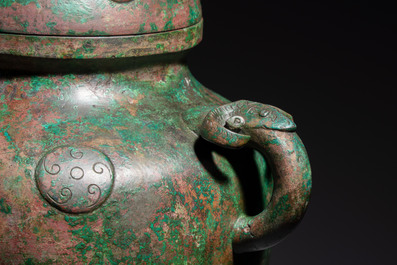 A large Chinese archaistic bronze wine vessel and cover with ram-form handles, Lei 罍, Ming