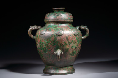A large Chinese archaistic bronze wine vessel and cover with ram-form handles, Lei 罍, Ming