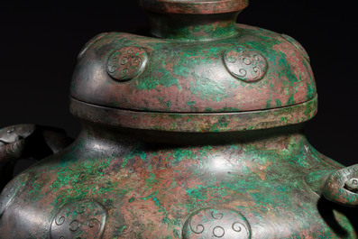 A large Chinese archaistic bronze wine vessel and cover with ram-form handles, Lei 罍, Ming